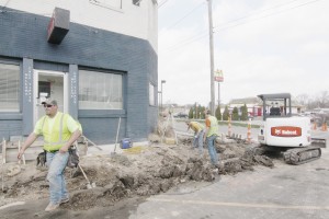 Photo by Keith Stewart Feutz construction workers break up the old sidewalk in front of Chef Tippy's in Sullivan. The segment of sidewalk is just one of several areas to see newly poured concrete in the coming weeks as part of phase II of the Streetscape Project.