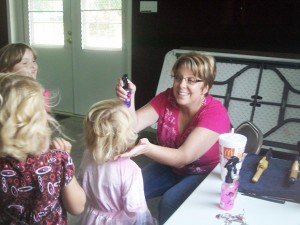 Submitted Hair sylist Julie Kinert creates a new look for one princess Saturday at the Lovington Church of God.