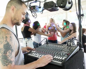 Photo by RR Best DJ Mike Marshall kept dozens of kids happily moving to music last Friday during the first organized event at Wyman Park aimed at keeping area kids preoccupied with something new and fun.