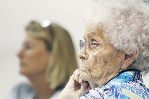 Photo by Keith Stewart Katherine Butt of Sullivan listens as area seniors took to the VFW in Sullivan Tuesday night, filling its banquet hall in order to ask questions as well as vent about their frustration over the expected shift to frozen meals come October 1.  After Eastern Illinois University announced earlier this year that it would cease sponsoring the Senior Peace Meal Program, a bidding process began that eventually awarded CRIS Healthy Aging Center of Vermilion County.