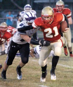 Photo by RR Best ALAH’s quarterback Tyler Schuring tries to escape an Oakwood defender. Schuring passed for 153 yards and four touchdowns.