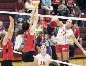 Photo by Keith Stewart The Lancers’ Jessica Davis puts a kill on during Monday night’s matchup with Sullivan. Davis had plenty of big hits in the third set to give her team the momentum it needed to ensure the win and its continued undefeated streak, which stands at 9-0.