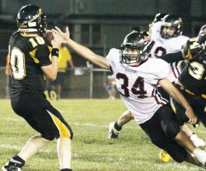 Photo by Keith Stewart SOV senior linebacker Kainan Bushert goes to strip the ball from Tuscola quarterback Zach Bates Friday night. Bushert’s defensive showing included one fumble recovery.