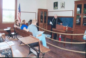 Submitted Glenn Austin informs guests about what it was like to be students and teachers at Center School, a one-room school house located at The Great Pumpkin Patch.