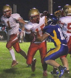 Photo by Keith Stewart Jordan Feagin tries to escape the clutches of a Villa Grove defender during Friday night’s game. Feagin ran 65 yards on nine carries as well as had three receptions for 57 yards, including one for a touchdown.