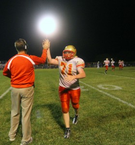 Photo by Keith Stewart David Rosenbaum receives a high-five from head coach Dale Schuring after a big play late in the game.