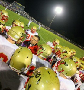 Photo by Keith Stewart ALAH defensive coordinator Jared Vanausdoll amps up his players during Friday's game at Villa Grove.