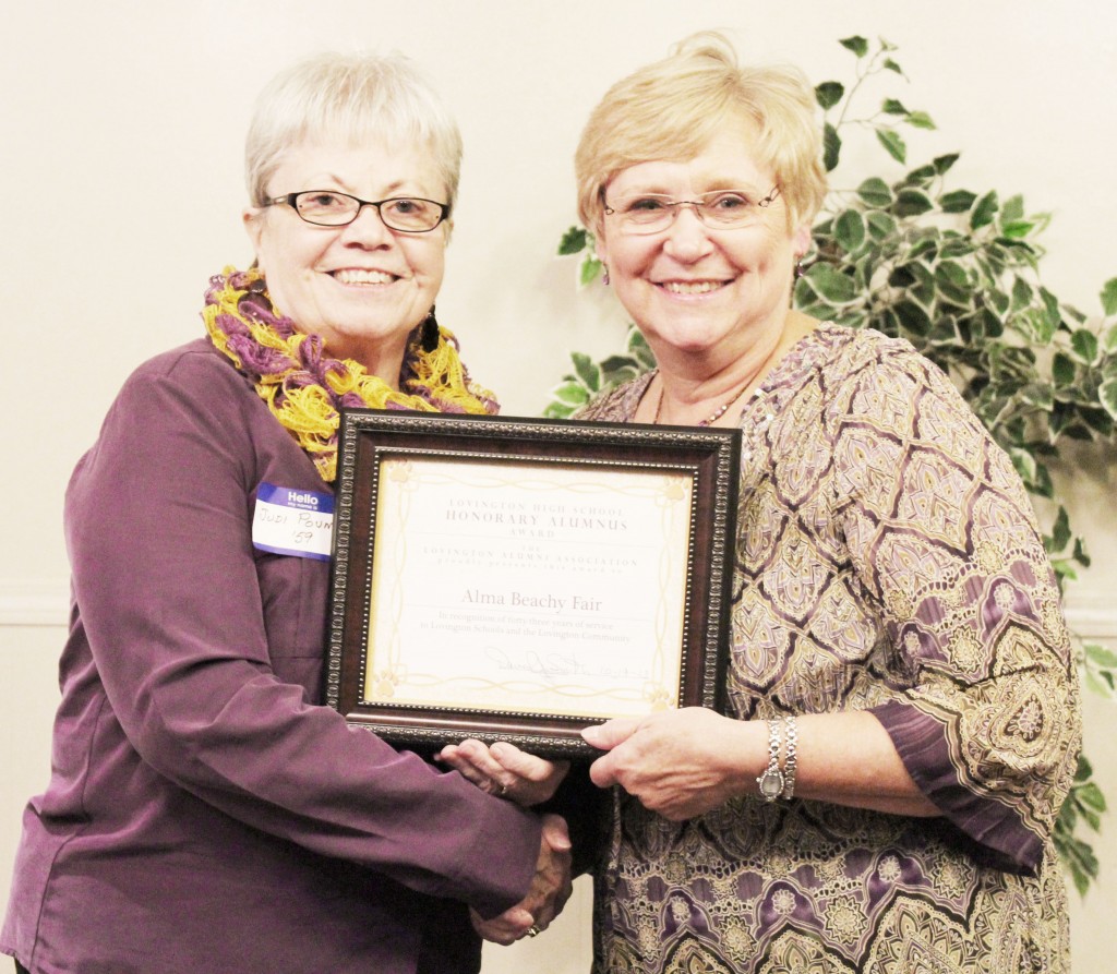 Submitted by Alma Fair Honorary Alumnus This award was presented to Alma Beachy Fair for her contributions to Lovington schools, the Lovington community, and especially to the alumni association in the 43 years she has lived in Lovington. Presenting the award is Judi Pound, class of 1959.