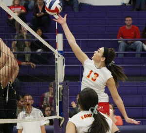 Photo by Darian Hays Junior Jessica Davis tips the ball over Tuesday night against Atwood-Hammond.