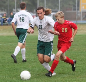 Photo by Keith Stewart Mattoon's  Chase Harvey battles ALAH's Brad Miller for the ball.