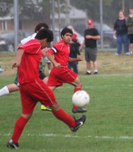 Photo by Keith Stewart ALAH's Javi Briseno crosses the ball to teammate Omar Martinez during their game against Mattoon a week ago Saturday.