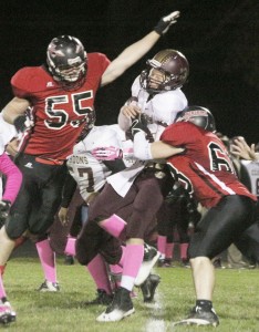 Photo by Keith Stewart Allen Cooley (right) and Jordan Cuttill (left) swarm Clinton’s quarterback Tanner White.