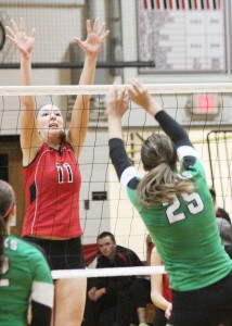 Photo by Keith Stewart Sullivan’s Brittin Boyer goes up for the block against Meridian’s Maggie Comerford, who was a force on the front line last Thursday as she helped lead her team to a 25-12, 25-17 win over the Lady Red.