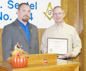 Photo by Barry Featheringill Sheriff Jeff Thomas (right) is seen with his Community Builder Award presented to him by Jonathan Book, George A. Sentel Lodge Master.