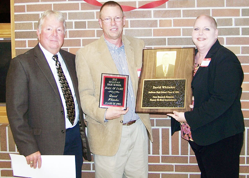 Submitted Hall of Fame Recipient David Walter Whitaker, SHS class of 1980, was this year’s recipient of the Hall of Fame honor. Whitaker was presented and introduced by his sister Pam Whitaker Buckalew. Whitaker, who’s early interest and passion was in Future Farmers of America, went on to earn an undergraduate degree in agricultural science at the University of Illinois followed by a master’s degree in plant breeding from the University of Minnesota. Whitaker then went on to fulfill a successful career as a research scientist, developing different hybrid seeds. Whitaker has earned several awards for his work over the years including, but not limited to, the 2008 co-recipient of the Pioneer Hybrid of the Year, 2010 Pioneer Inbred of the Year, co-recipient of the 2013 DuPont Bolton/Carothers Innovative Science Award, and the International Hybrid of the Year Award by Pioneer in 2008. Pictured from left to right is Sullivan school board chairman Steve Poland, David Whitaker, and Pam Whitaker Buckalew.