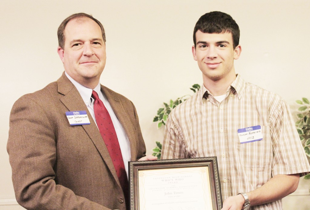 Submitted by Alma Fair Who’s Who Among Lovington Graduates An award was presented to John Timm, class of 1905, for his success as a lawyer in Chicago and for his philanthropy to the Lovington School District and many organizations in the communities of Arthur and Lovington.  Presenting the award is Aaron Fleming, class of 2012 and receiving posthumously for John Timm is State Bank of Arthur vice president Scott Seegmiller.