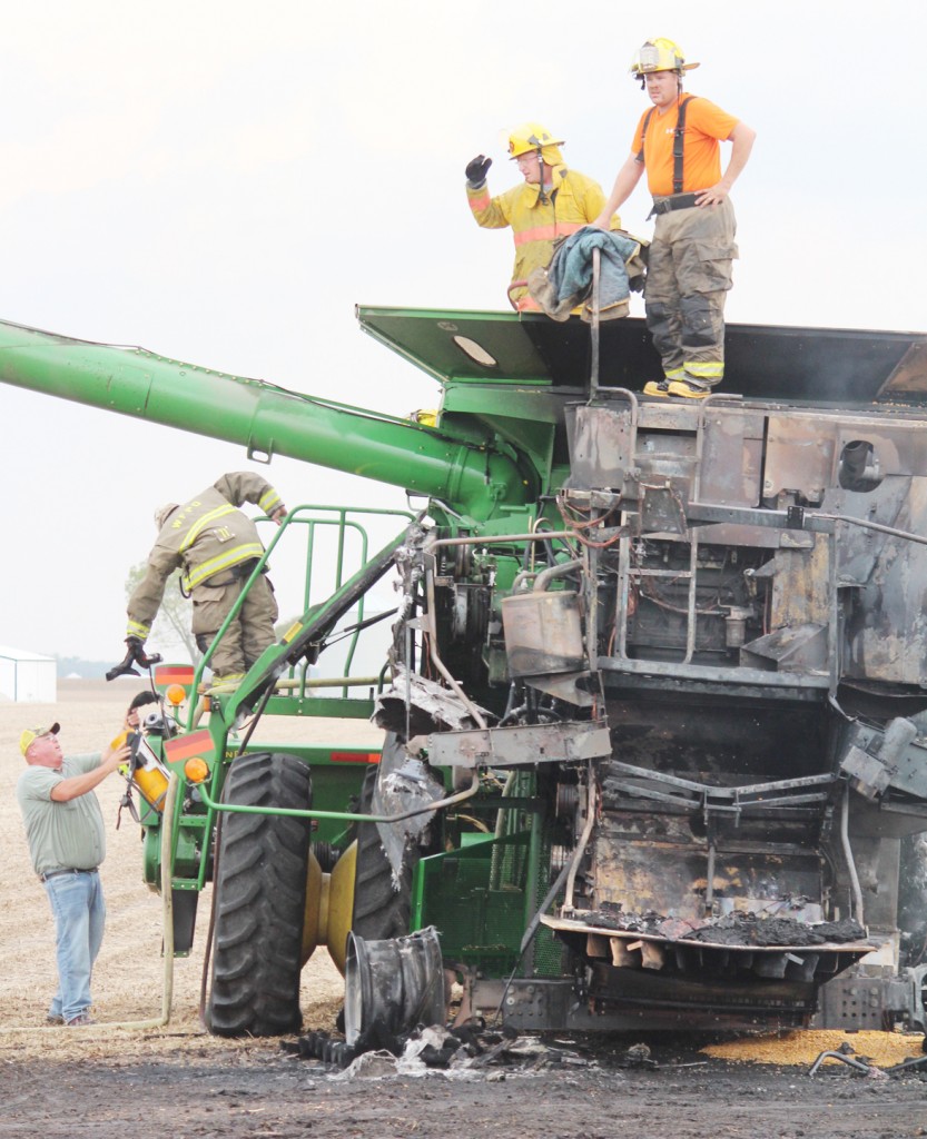 Photo by RR Best Combine Catches Fire A combine that was harvesting corn between Windsor and Gays caught fire Saturday afternoon, but no injuries were reported. The cause has yet to be determined. According to Windsor Fire Chief Rick Allen, the combine belonged to Richard Phipps and was, in his opinion, a complete loss. Upon realizing the combine was on fire, the driver abandoned the field in hopes of preventing any remaining crop from catching fire. The combine was driven across a roadway and two ditches into an adjacent soybean field that had previously been harvested. The fire was contained within approximately 30 minutes, according to Allen.