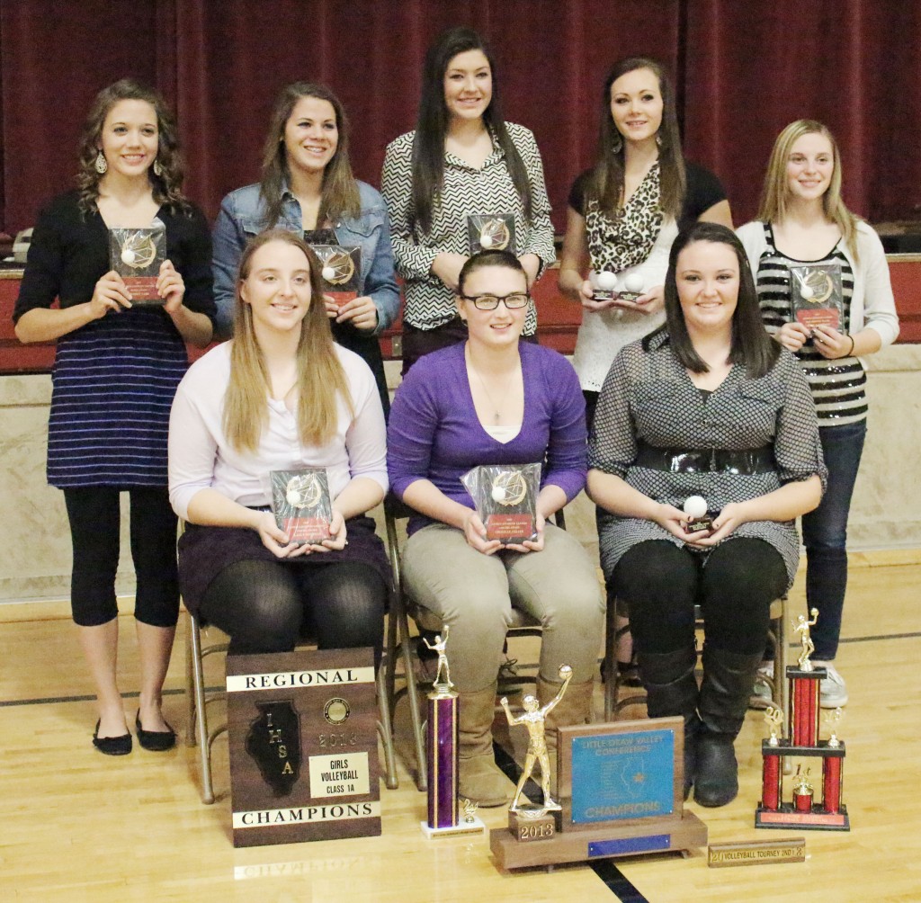 Photo by Darian Hays AL Volleyball Banquet Awards The Arthur-Lovington volleyball team held their awards banquet Tuesday, November 19. Pictured are this year’s award recipients. Front row, L-R: Brooke Tabb, best serve percentage (94), best attack percentage (90), most digs (281), and hustle award; Kalli Martin, team spirit award; Emily Seegmiller, most aces (55), and most valuable player; Jessica Davis, best attack percentage (90), and best block percentage (19); Logan Kauffman, most improved. Back row, L-R: Karly Goodman, best ace percentage (21), highest kill percentage (40) and most kills (206), most blocks (27), best block percentage (19), serve-reception percentage (90), sportsmanship and coaches’ award; Sherelle Coller, best setting percentage (98), most assists (563), assist percentage (33), variety captain, and coaches’ award; Hannah Schrock, best block percentage (19). The team also celebrated three All-LOVC selections. First team: Karly Goodman and Emily Seegmiller; second team: Sherelle Coller.