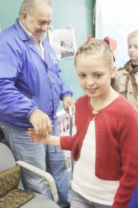 Photo by Keith Stewart SES fifth grader Zoey Walton shakes Francis Drummond Jr.’s hand after he spoke to her class about his experiences in the military and life.