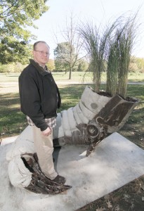 Photo by Keith Stewart Cary Netherton, a Sullivan native and now Minneapolis based sculptor, stands with his newly reassembled creation “Fallow”, which he donated to the city of Sullivan and that now resides in Tabor Park.