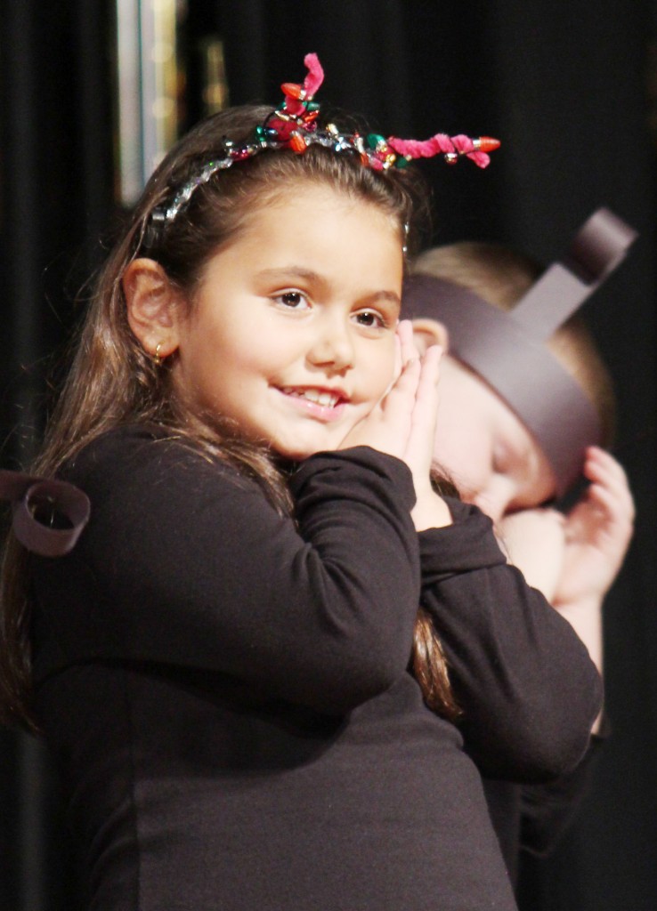 Photo by RR Best SES Christmas Program Sullivan Elementary School student Elira Halili performs during the SES Christmas Program last Thursday.  To see more photos, be sure to visit www. moultriemoments.com