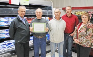 Photo by RR Best Pictured from left to right are: Bethany Foods owner Atta Abbed, Bethany mayor Bill Ashley, village trustees Dick Roe and Craig Wigness and former Bethany mayor Barb Meador.