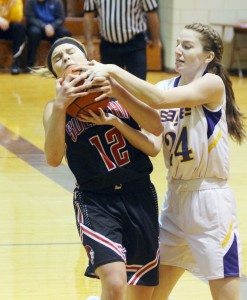 Photo by Keith Stewart Emily Neuhauser battles Monticello's Hannah Smith for the ball Thursday night.