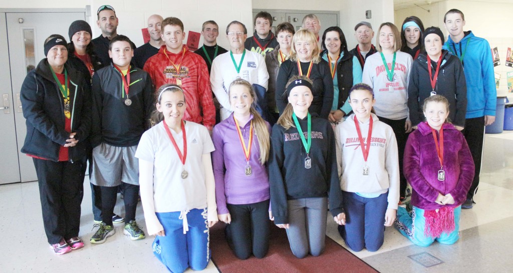 Photo by Keith Stewart Reindeer Run Winners The Sullivan Singers’ Boosters Club hosted their second annual Reindeer Run 5k on a frigid Saturday morning in Wyman Park. Pictured are those who earned medals during the run: Brent King, overall male winner, 18:59; Laine Cameron, overall female winner, 21:29; 19 & under male-Josh O’Brien, first, 19:46; Travis Hanson, second, 24:03; Liam Bechtold, third, 27:25; Jed Wheeler, fourth,  28:49; Brayton Sparrow, fifth; and Ty Binnion, sixth, 41:07. 19 & under female–Jordan Bassett, first, 24:52; Madison Wall, second, 25:53; Kennedy Lucas, third, 25:41; Taylor Booker, fourth, 27:59; Ciara Anderson, fifth, 28:20; Lily Bales, sixth, 28:42; and Mackenzie Ruppert, seventh, 28:42. 30-39 male–Marc Dal Ponte, first, 22:25; Chris Ballinger, second, 28:31; 30-39 female–Jodie Carey, first, 30:55; Rachel Elzy, second, 34:01. 40-49 male–Brian Sparrow, first, 25:53; Rich Banning, second, 26:30. 40-49 female–Angie Cameron, first, 26:47; Lori Sparrow, second, 29:22; Cartha Foley, third, 29:33; and Connie Mulligan, fourth, 31:21. 50-59 male–James Ewing, first, 30:45. 60 + male–Larry Wilson, first, 21:35; Mike Faught, second, 25:30. 5k Walk–Abigail Chapman, first, 42:05; Chris Chapman, second, 42:05; and Angie Hayes, third, 42:05. 1 Mile Deer Dash–Marc Dal Ponte, first, 9:45; Sydni Mulligan, second, 13:02.