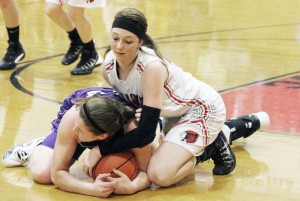 Photo by Keith Stewart Brittin Boyer tries to pull the ball loose from Shelbyville’s Madison Boone Monday night. Sullivan’s defense had more than a helping hand in the Lady Ram’s 36 turnovers, while the offense was in high gear. Both facets of gameplay earned Sullivan an 83-38 win.