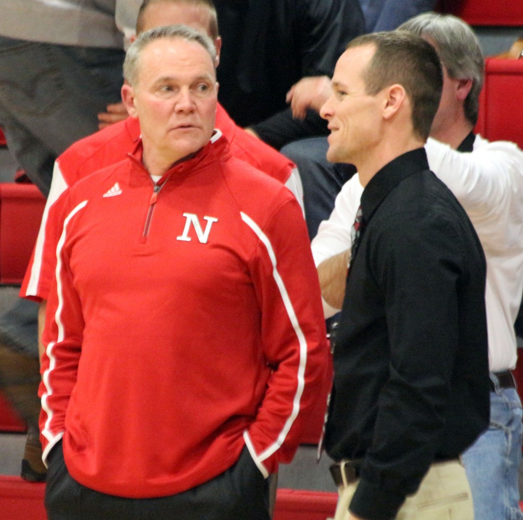 Photo by Keith Stewart Former SHS basketball coach (and current Neoga coach) Bob Lockart and current SHS coach Chester Reeder talk before the start of Saturday's game in Neoga.