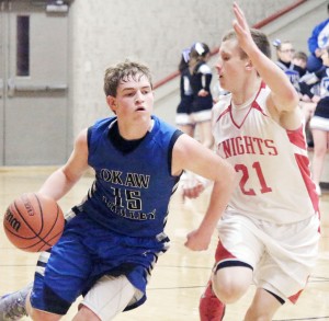 Photo by Darian Hays OV’s Peyton Hagerman tries to get past Arthur-Lovington’s Tyler Schuring Tuesday night in the LOVC tournament in Arthur.