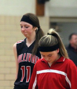 Photo by Keith Stewart Tori Murphy (front) and Brittin Boyer (back) each look down in disappointment after losing to Clinton Thursday 71-65.