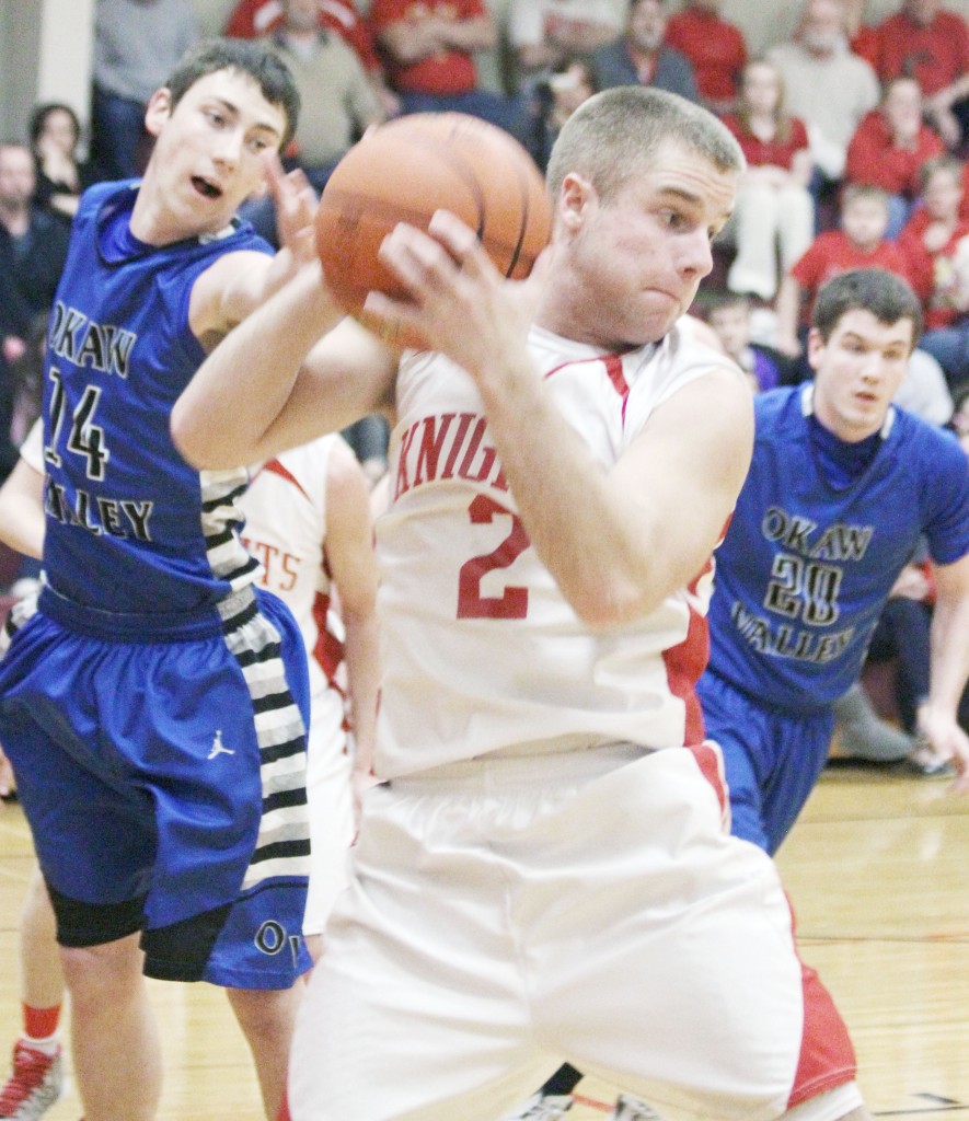 Photo by Keith Stewart Clayton Honn grabs the rebounds over Brody Sparks Tuesday night.