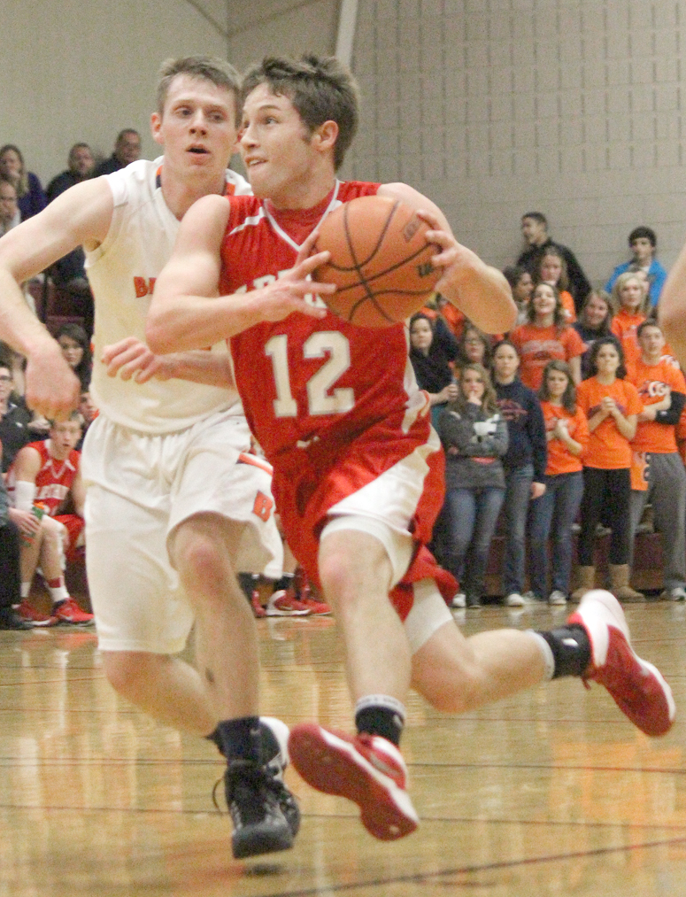 Photo by RR Best AL’s Curtis Plank drives to the basket Saturday night. Plank led the team with 16 points.