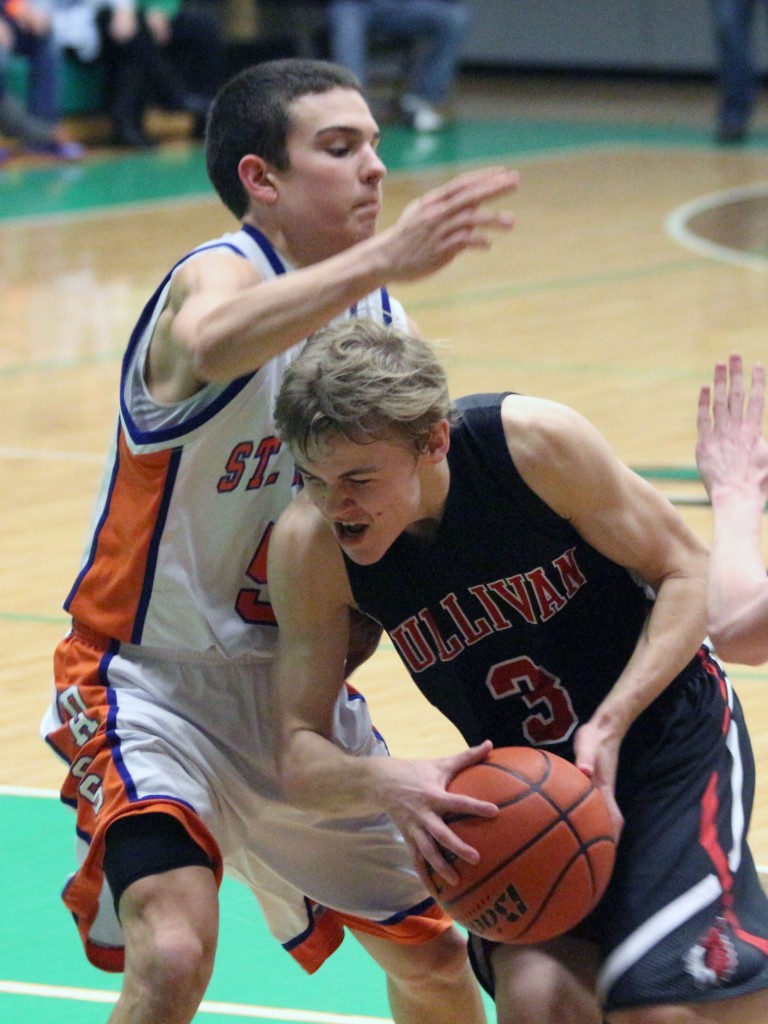 Photo by Keith Stewart Alec Ballinger powers his way through the paint Thursday night.