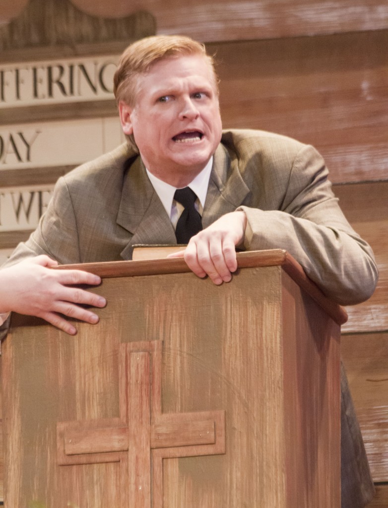 Photo by Keith Stewart Rev. Mervin Oglethrope, played by Gregory Matzker, clenches the pulpit after considering to allow Dennis Sanders a go.