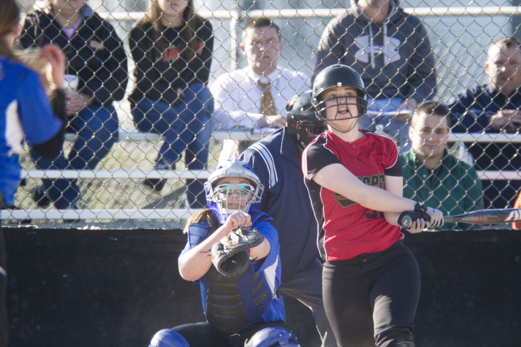 Photo by Keith Stewart Sherelle Coller eyes her deep shot to left field in the fifth inning of Wednesday’s game against OV. The senior, along with teammate Katie Wildman, celebrated her birthday with an 8-5 win.