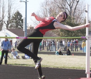 Photo by Keith Stewart SOV’s Megan Dash clears the  bar during the high jump last Wednesday at the Arthur Invite. The sophomore cleared five feet to take first place.