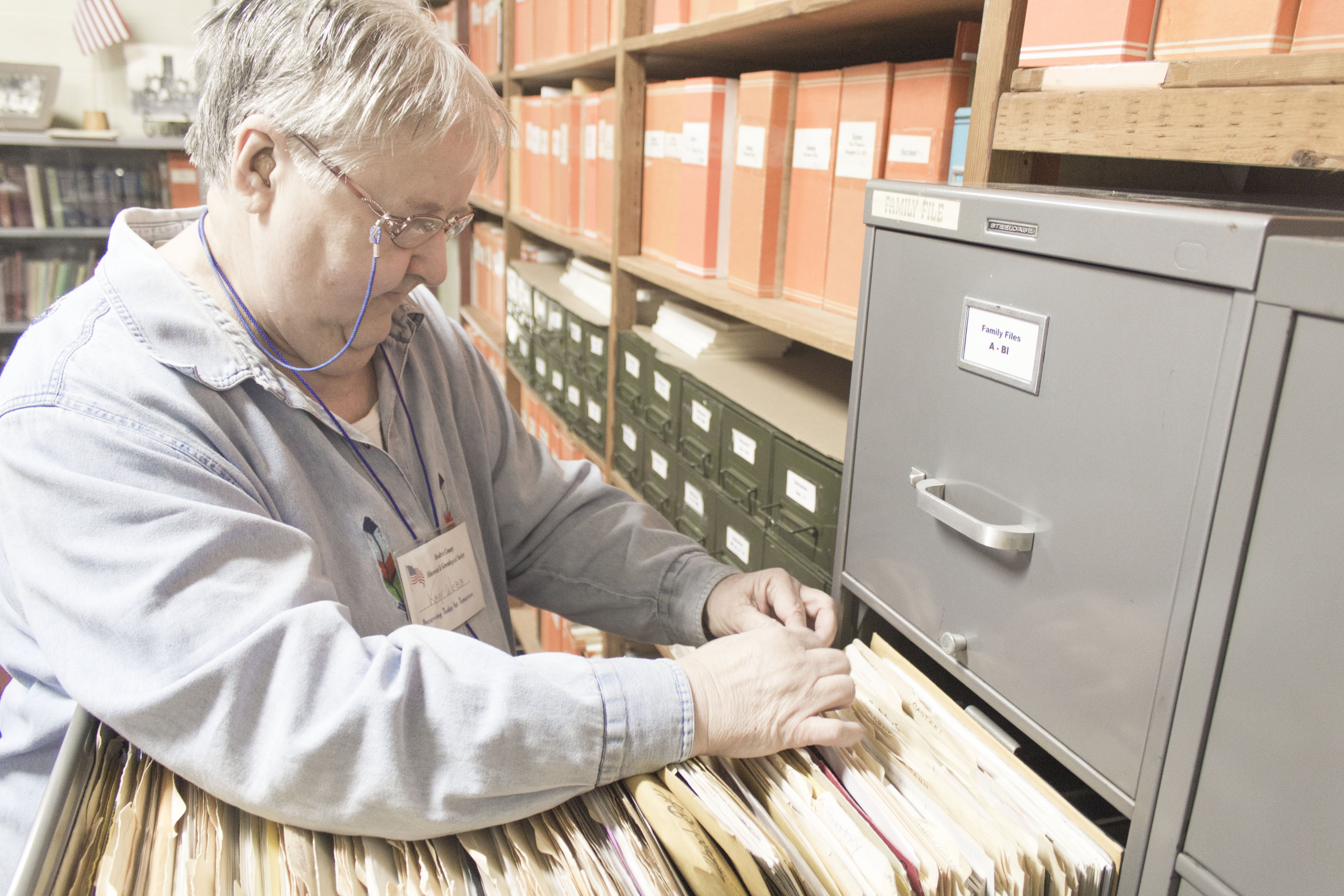 Photo by Keith Stewart Moultrie County Historical Society family researcher Kaye Webb sorts through files at the heritage center in Sullivan.