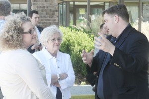 Photo by Keith Stewart State Senator Chapin Rose (R-Mahomet) speaks with Sullivan mayor Ann Short (center) and Sullivan Chamber and Economic Development Director Stephanie McMahon (left) just outside the Eagle Creek Resort Friday, April 25. They along with several other local offi cials toured the perimeter of the facilithy after holding a public meeting in Findlay discussing the future of the resort.