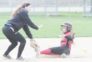 Photo by Keith Stewart OV’s Abigail Weybright goes to catch the throwout at second as ALAH’s Mycaela Miller slides.