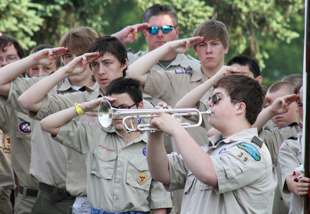 Photo by Keith Stewart Saluting, Memorializing During the Memorial Day Service at Greenhill Cemetery Monday, members of Boy Scout Troop 39 salute those veterans who gave their lives while serving their country.