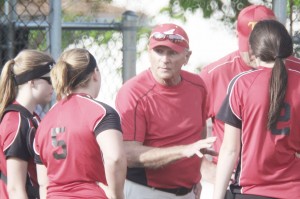 Photo by Keith Stewart Arthur-Lovington/Atwood-Hammond assistant coach and former Sullivan head softball coach Jerry Lane talks to his girls between innings of Monday’s game. Sullivan downed the Lancers 8-1 but will face them again in the Shelbyville regional next Tuesday at 7 p.m.