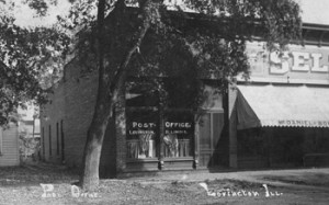 Moultrie Moment of the Week                                                    Pictured here is the Lovington Post Office circa 1909. The post office was located on the north side of State St.  in Lovington. The building located on the left is McDaniels & Bowers Goods. If you have any other information, please contact the Moultrie County Historical Society at 217-728-4085.