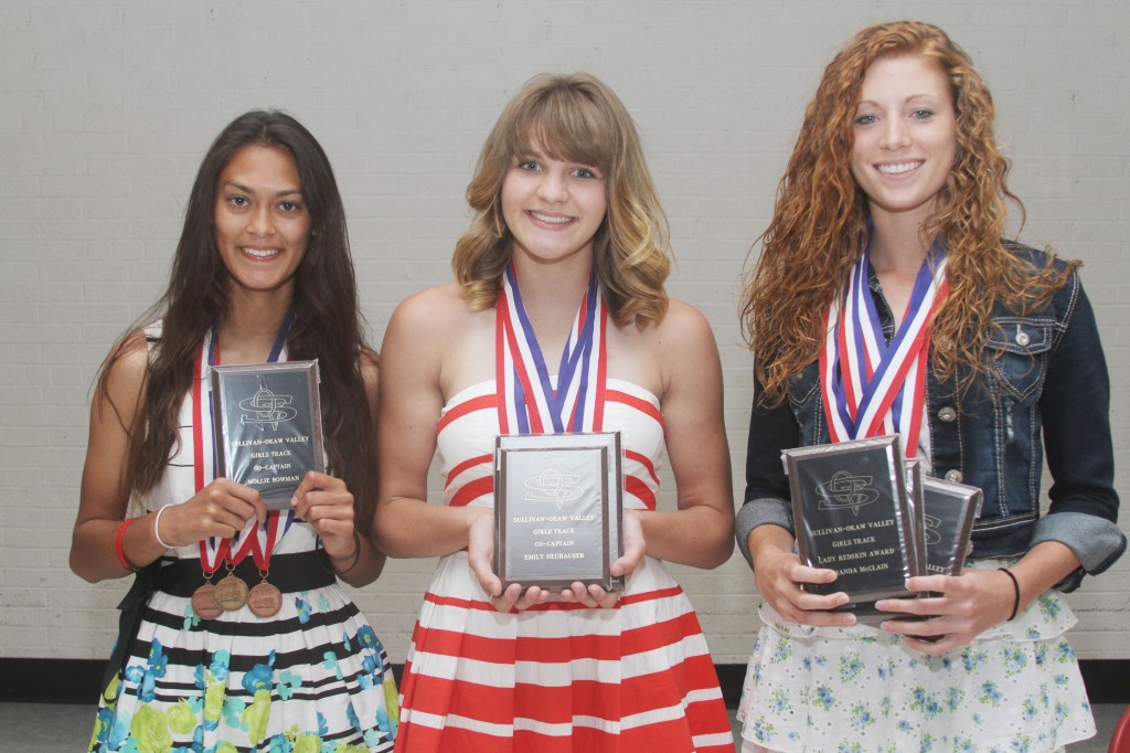 Photo by Keith Stewart SOV Girls’ Track Awards The Sullivan-Okaw Valley girls’ track team held their awards’ banquet on May 29. Pictured, left to right, are: Mollie Bowman, co-captain; Emily Neuhauser, co-captain; and Amanda McClain, co-captain, high-point award, and Lady Redskin award.