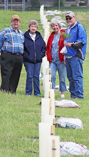 Photo by RR Best Pictured are those who volunteered to replace the treeline at Okaw Valley Middle School two weeks ago. From left to right: Roger Kirkwood, Lillian Beckett, Nannette Ramsey, and Mike Cummins.