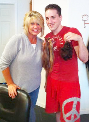 Submitted Local hair stylist Candy Cox (left) and Ricky Punches  (right), each hold up their recently cut locks of hair, which they plan to donate to Locks of Love.