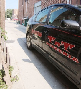 Photo by Keith Stewart A TNT Pizzeria delivery vehicle sits in the alleyway, which was the site of an incident last month when a Little Theatre staff member and a TNT delivery collided. As a result, the Sullivan City Council is considering an ordinance making the alleyway a one-way after the request by LTOTS executive director John Stephens. However, TNT owner Tim Rose doesn’t believe that will prevent another such occurrence in the future.