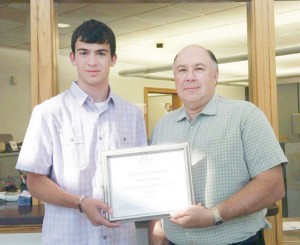 Submitted Pictured is Aaron Fleming of Lovington, a recent FRED scholarship  recipient (left) and David A. Cawthon, general manager of Moultrie Independent Telephone Co. (right).