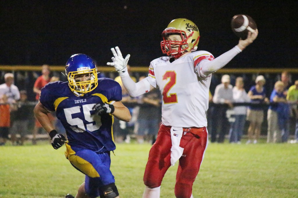 Photo by Darian Hays Knights Fall Tyler Schuring (no. 2) goes to pass as a Villa Grove player closes in Friday night. Schuring went 8-25 for just 36 yards and one interception while rushing for 140 yards on 20 attempts during his team’s 20-6 loss to Villa Grove. The Knights now begin what is one of four consecutive home games beginning with Martinsville this Friday.